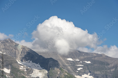 Clouds over summit at Grossglockner mountain range view from Taxenbacher Fusch high alpine road in Austria