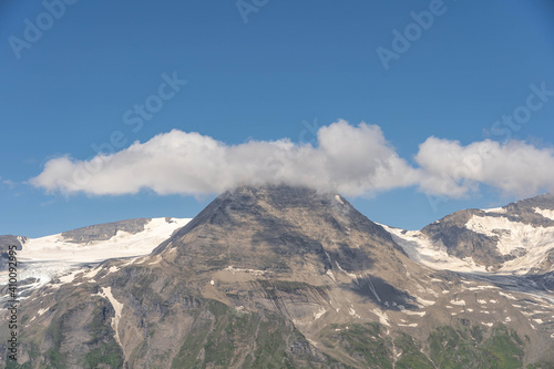 Clouds over summit at Grossglockner mountain range view from Taxenbacher Fusch high alpine road in Austria