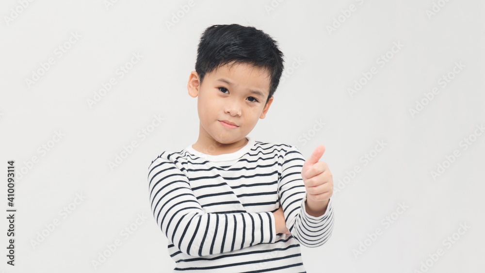 Asian little boy isolated smiling and raising thumb up Asian little boy isolated smiling and raising thumb up