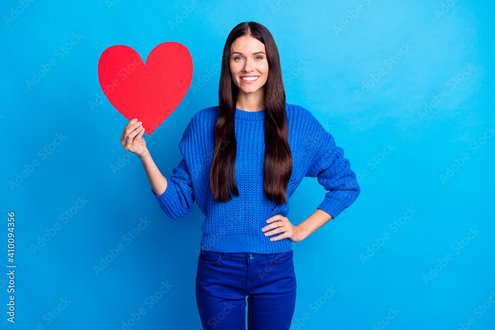 Photo of brunette optimistic nice lady hold paper heart wear blue sweater pants isolated on bright color background
