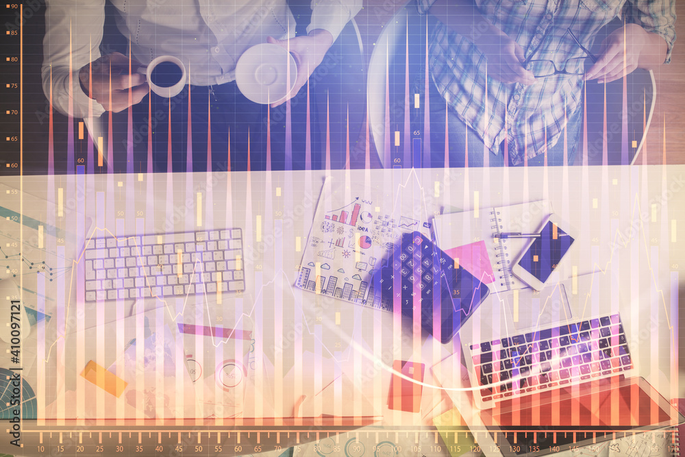 Double exposure of man and woman working together and financial chart hologram drawing. market analysis concept. Computer background. Top View. Double exposure of man and woman working together and financial chart hologram drawing. market analysis concept. Computer background. Top View.