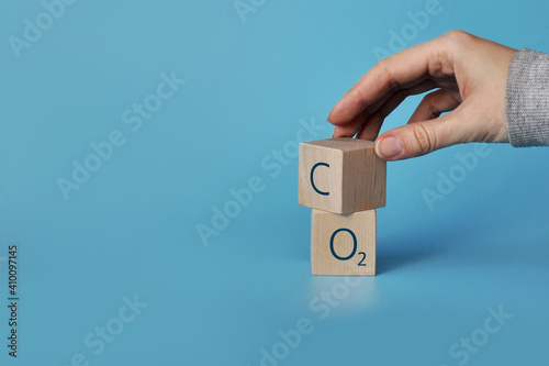 Wooden cubes with icons: oxygen and carbon dioxide. The clean air and the environment