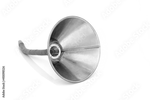 Flexible galvanized metal funnel used to funnel oil or any liquid. On white background with copy space.