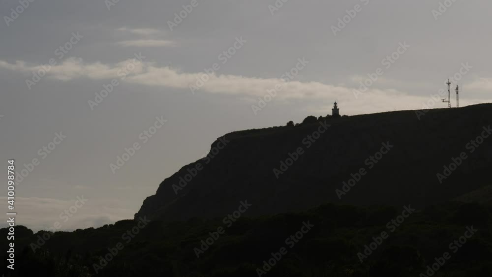 Santa Pola cliff with lighthouse at evening. Alicante province. Spanish Costa Blanca coastline. Santa Pola cliff with lighthouse at evening. Alicante province. Spanish Costa Blanca coastline.