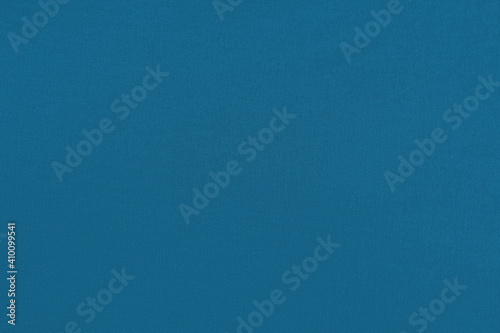 Blue homogeneous background with a textured surface