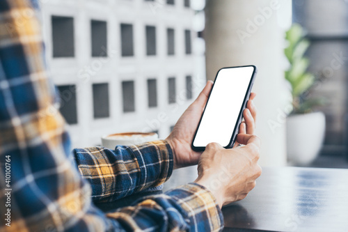 cell phone blank white screen mockup.woman hand holding texting using mobile on desk at office.background empty space for advertise.work people contact marketing business technology