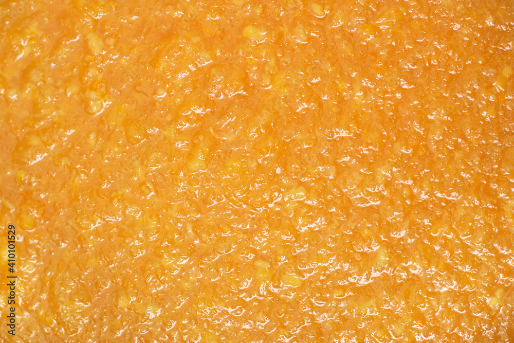 The texture of delicious orange jam. The texture of delicious orange jam.