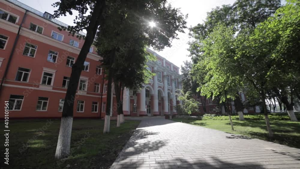 Timelapse of an empty street in front of the old university building on a sunny day