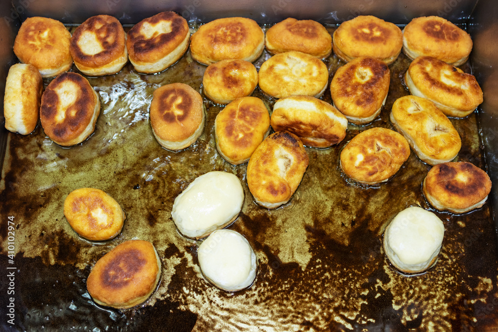 Donuts are fried in a deep fryer. Donuts are fried in a deep fryer.
