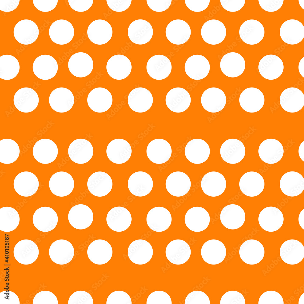 white polka dots on an orange background