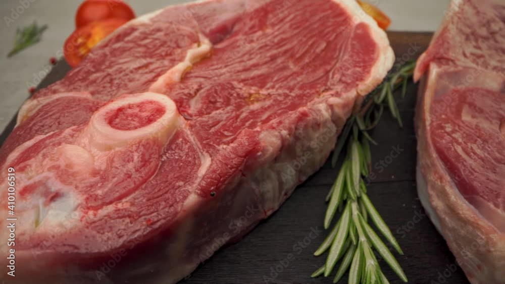 Raw beef steak with spice and seasoning close up Raw beef steak with spice and seasoning close up