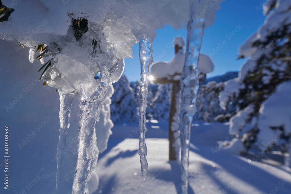 wooden cross covered with fresh snow at beautiful fresh winter morning