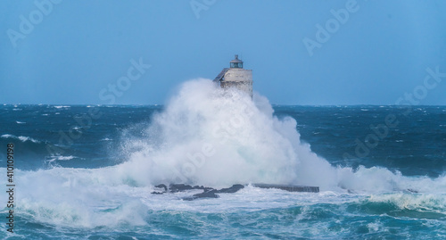 lighthouse of the mangiabarche of calasetta in a stormy day, sardinia 