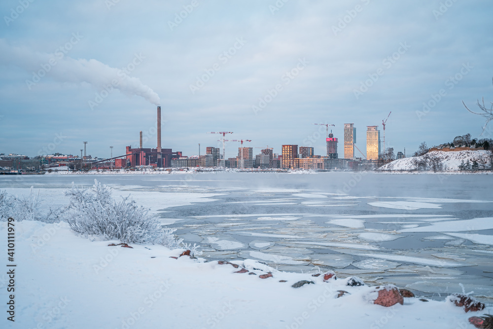 City skyline in Helsinki during winter with frozen sea