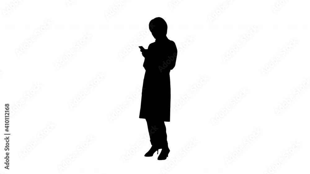 Smiling African American female doctor texting message on smartphone, Alpha Channel
