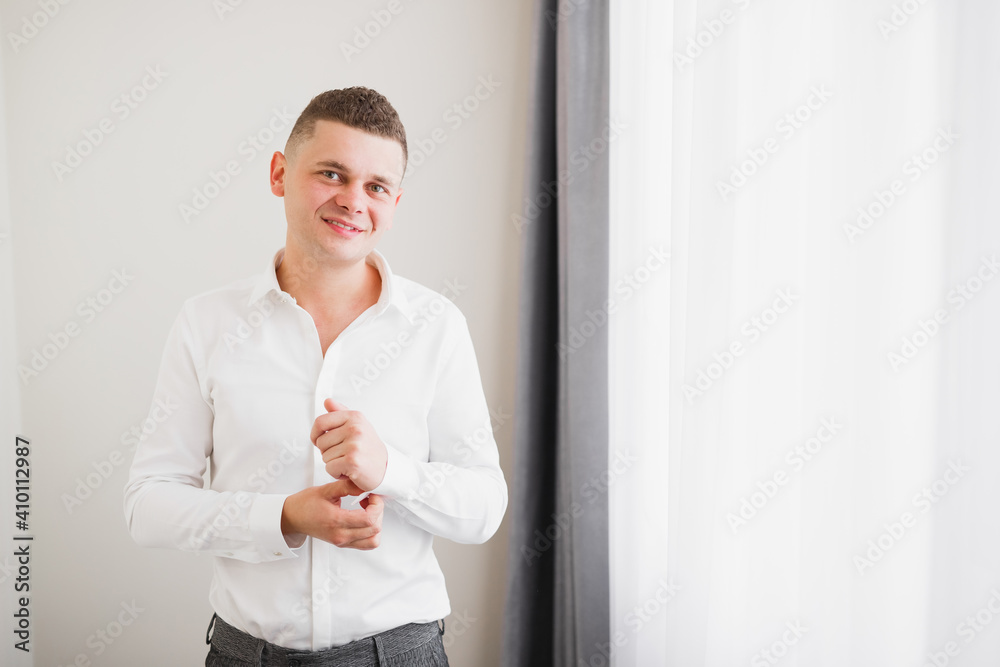 Young handsome man relaxing at his apartment in a hotel after business meeting Young handsome man relaxing at his apartment in a hotel after business meeting