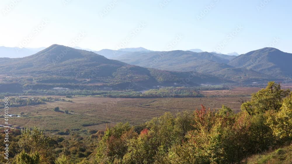 Incredible landscape of valley and mountains are covered with forest in the blue morning haze during the golden autumn time in Adygea, Russia
Incredible landscape of valley and mountains are covered with forest in the blue morning haze during the golden autumn time in Adygea, Russia