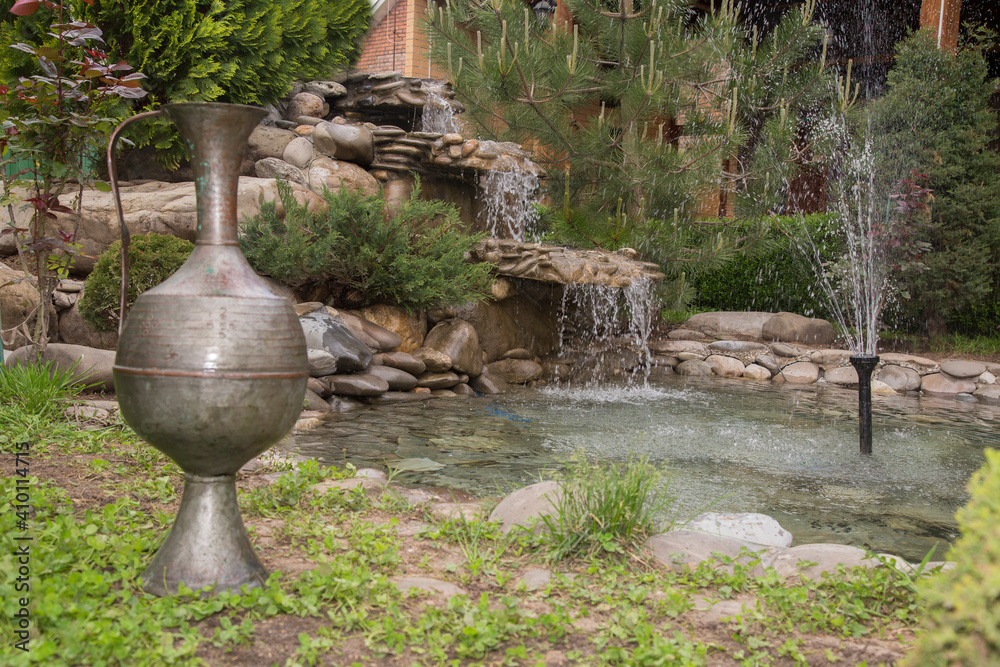 Beautiful nature with a fountain in the country cottage Beautiful nature with a fountain in the country cottage