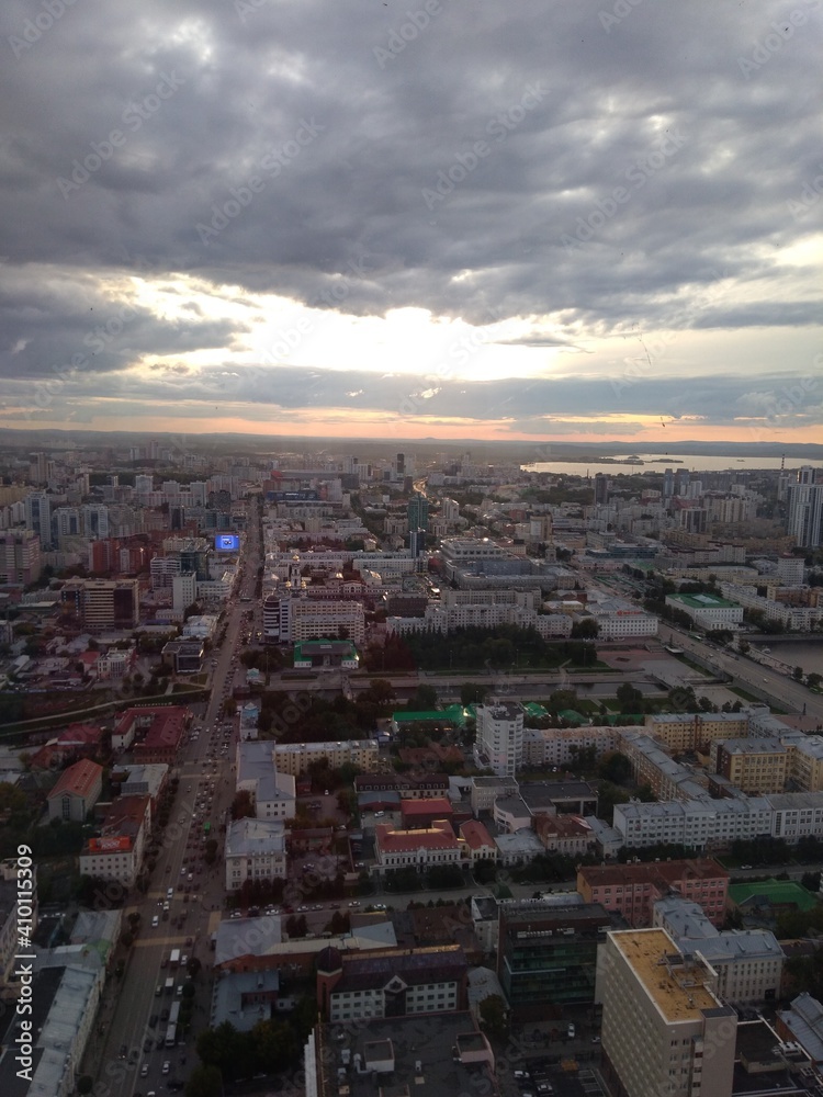 Fototapeta premium view of the city buildings and the sky from a height. High quality photo