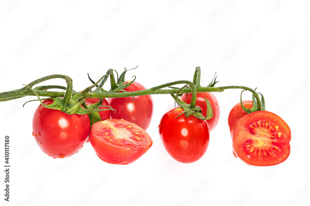 Cherry tomatoes isolated on white background with a tomato cut in half Cherry tomatoes isolated on white background with a tomato cut in half