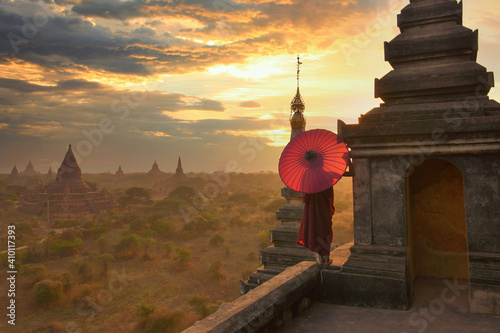 Monk relaxing in ancient temple on during sunset,Bagan Myanmar