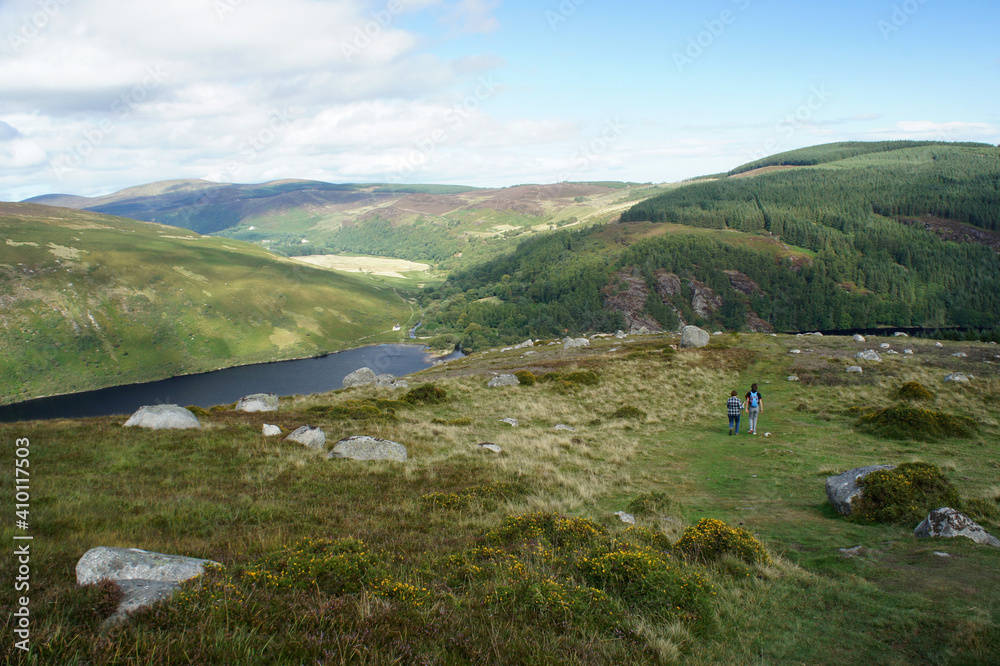 People walk near Lake Dan in the Wicklow Mountains, Ireland. People walk near Lake Dan in the Wicklow Mountains, Ireland.
