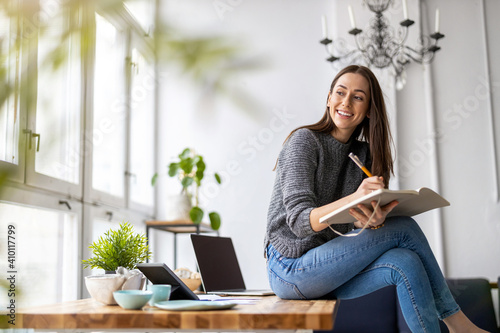 Young female freelancer working in loft office
 photo
