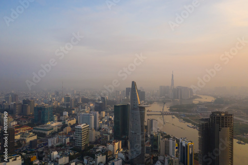 Heart of Saigon or Ho Chi Minh City Skyline, Vietnam aerial view at Golden hour with landmark buildings and river © Paul