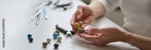Craft jewelery making with professional tools. A handmade jeweler process, manufacture of jewellery. photo