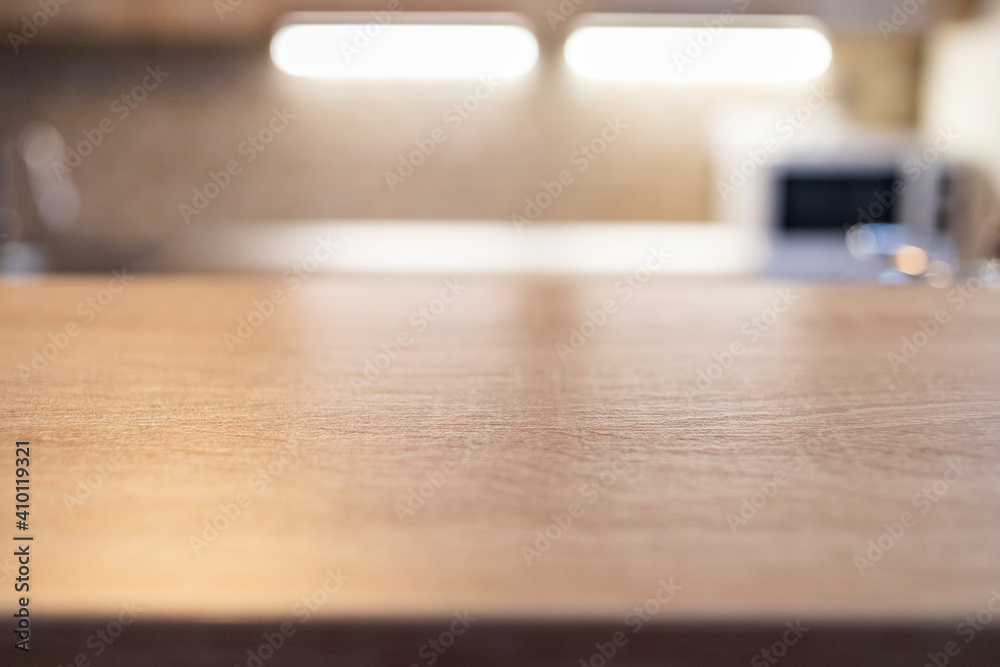 blurred kitchen interior and wooden desk space home background