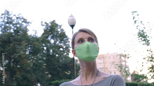 Adult woman wearing textile protective masks. photo