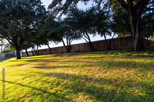 The Grassy Knoll and picket fence above Elm Street, Dallas, Texas. Possible John F Kennedy assassin location in 1963.