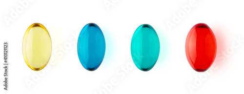 Yellow, blue, green and red transparent capsules isolated on white background horizontal banner format. Healthcare and medicine concept. Omega 3, vitamin A and E, painkiller pills