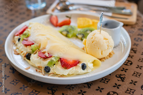 Cold crepes, vanilla ice cream with crepes and strawberry, sweet and desserts