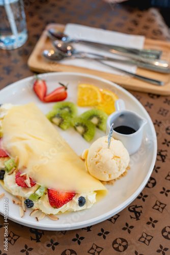 Cold crepes, vanilla ice cream with crepes and strawberry, sweet and desserts