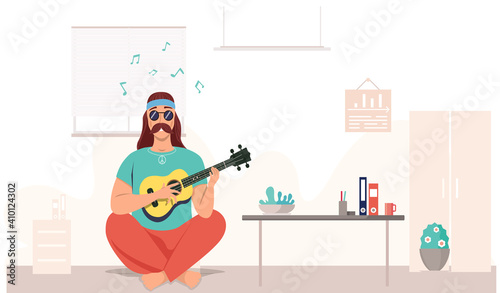 Male hipster bard with ukulele in hands. Musician is playing strings on instrument. Person creates music. Man with musical instrument. Guitarist playing guitar in living room