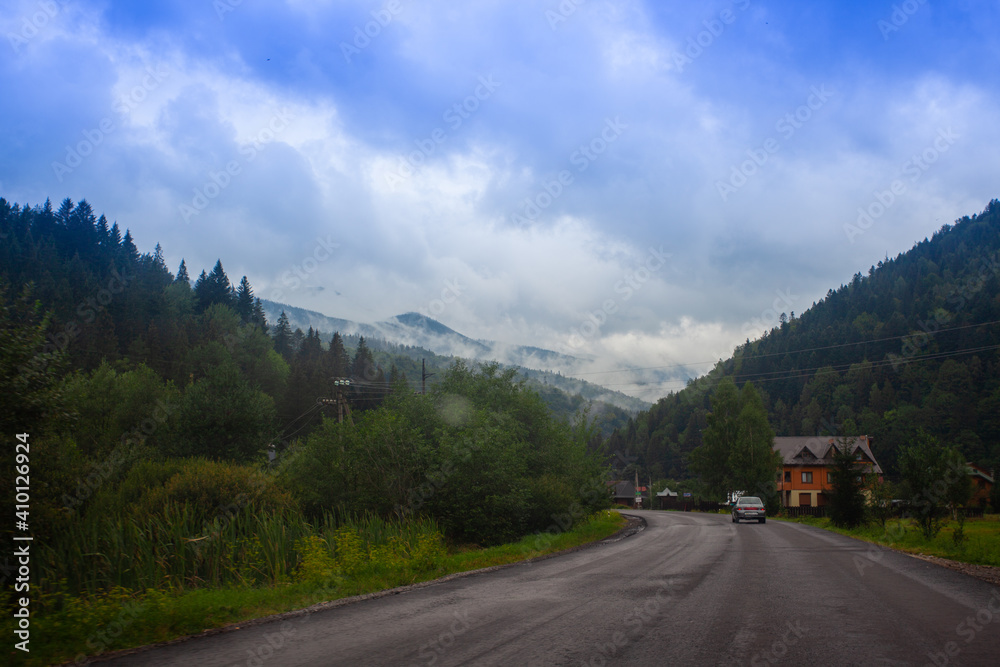 Mountains landscapes hiking trails wilderness forest fields and flowers farm car road haystacks Carpathians
