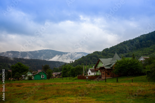 Mountains landscapes hiking trails wilderness forest fields and flowers farm car road haystacks Carpathians