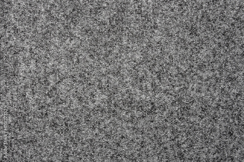 The texture of a dense gray carpet.Grey carpet background.