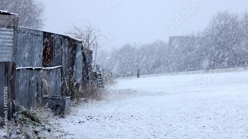 snowfall over farm fields with old outbuildings (ID: 410128116)