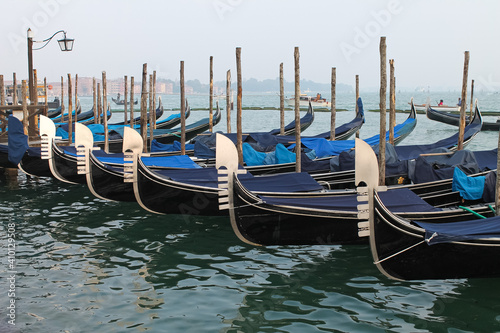 Venice, Italy - Winter 2020: empty gondolas stopped at the city center dock