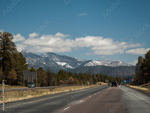 San Francisco Peaks seen from highway near Flagstaff, Arizona, USA road trip. These snow covered mountains are an eroded stratovolcano.. © Marianne Campolongo
