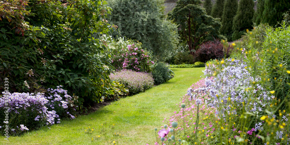 Old style country Scottish garden with mixed borders.