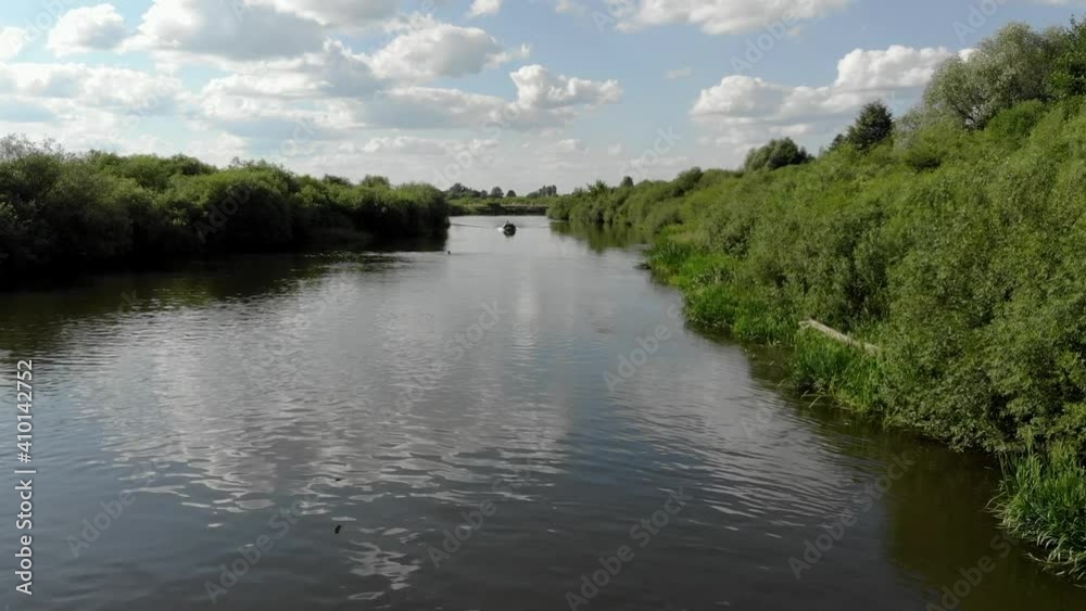 Flying on a drone over the river to meet the boat Flying on a drone over the river to meet the boat