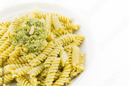 Pasta with pesto, basil leaves with white background