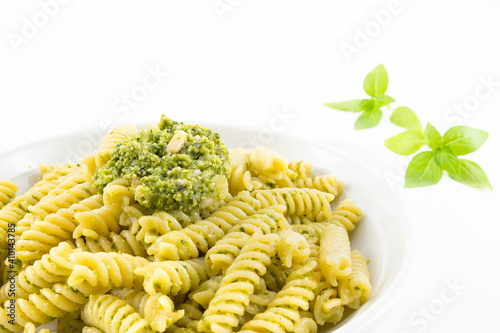 Pasta with pesto, basil leaves with white background