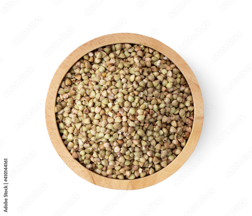 Buckwheat in wood bowl on white background Buckwheat in wood bowl on white background