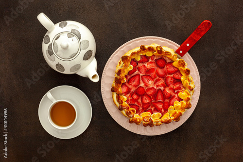 Fresh strawberry pie for breakfast with green tea