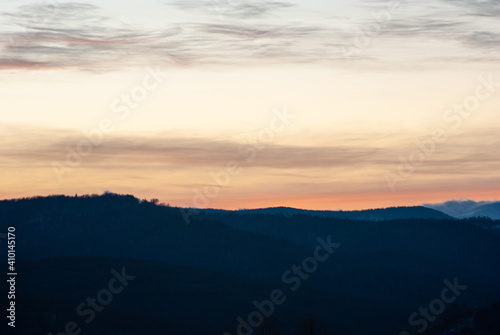 Silhouette of hills and forest at sunset © onyx124