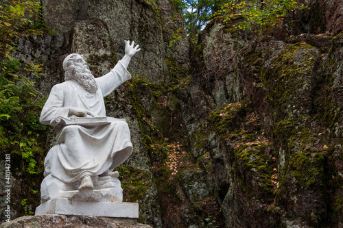 a statue of god in the mountains